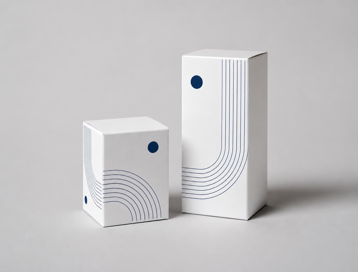 Printed white product packaging boxes with navy print, produced by Khunrut Printing